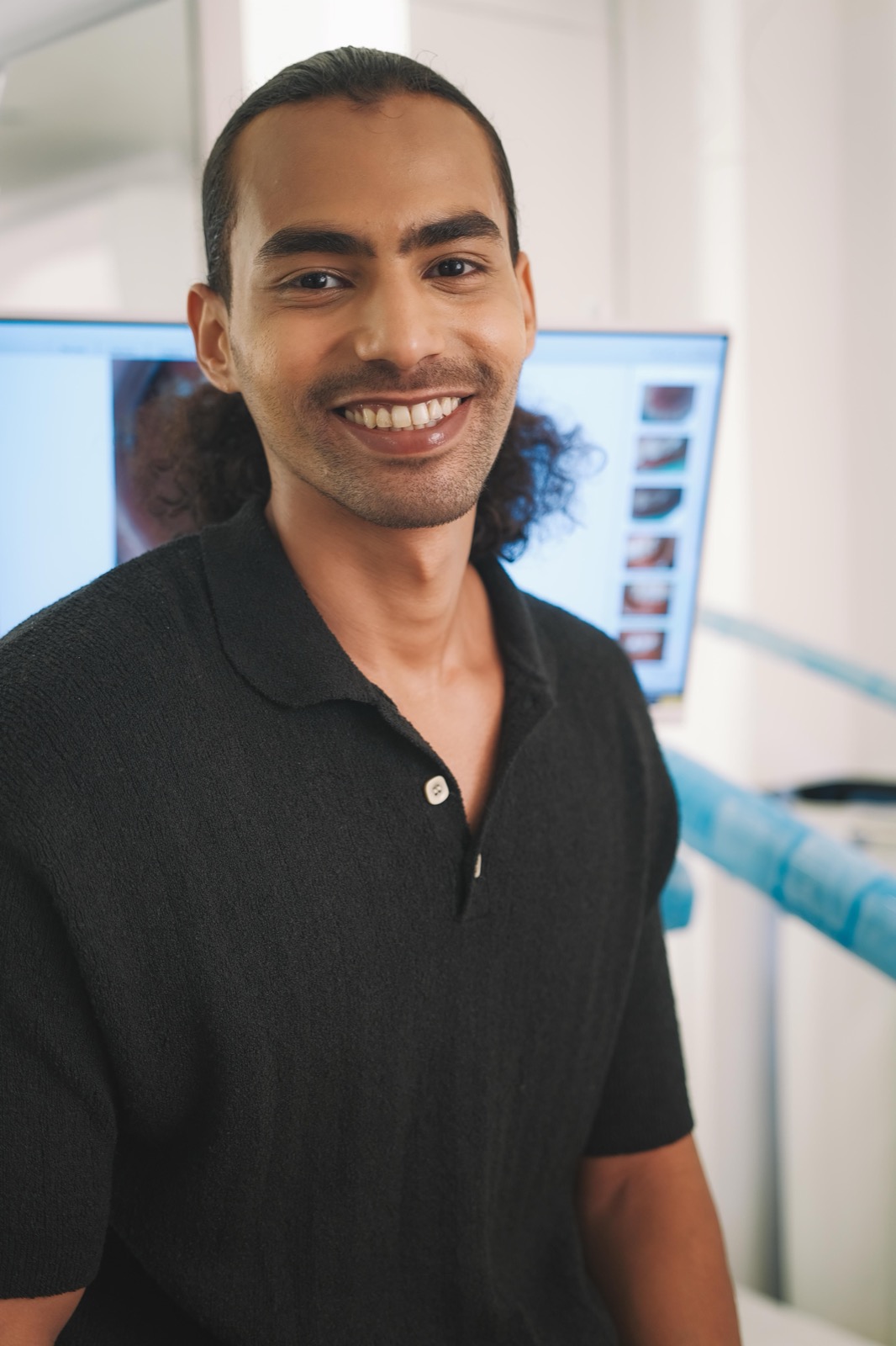 Patient smiling confidently after veneer treatment