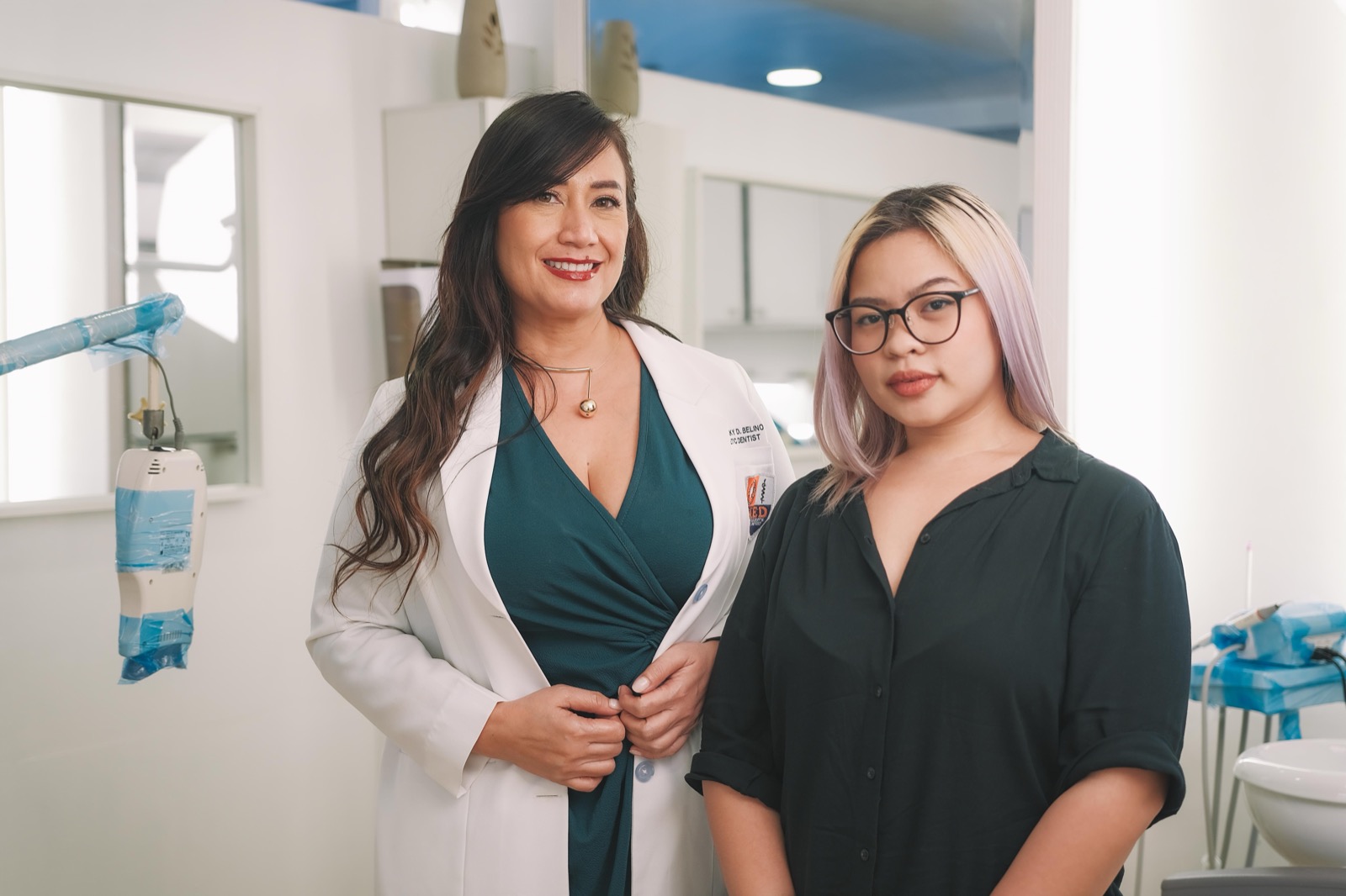 Dr. Twinky with a patient in the bright clinic before treatment