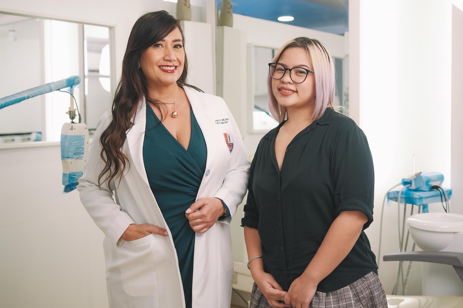 Dr. Twinky and a delighted patient smiling together after treatment