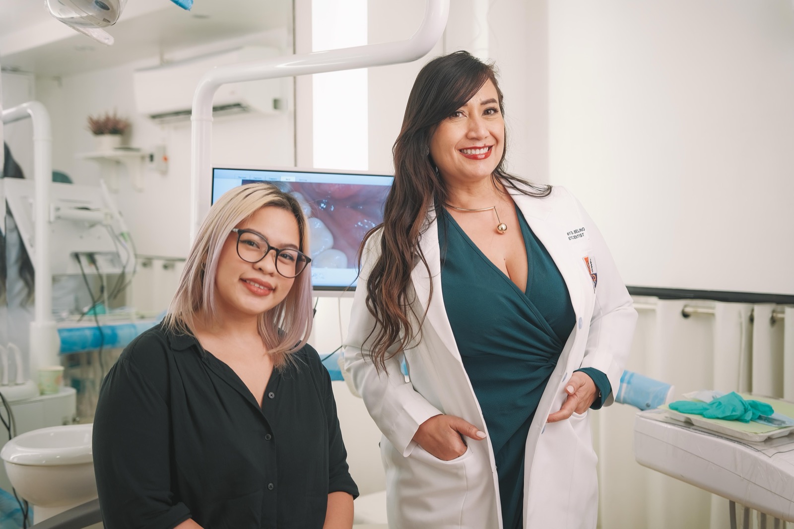 Dentist and smiling patient reviewing a completed smile makeover